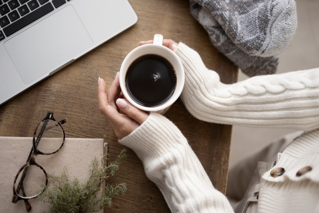 close-up-hands-holding-coffee-mug_23-2149304931.jpg